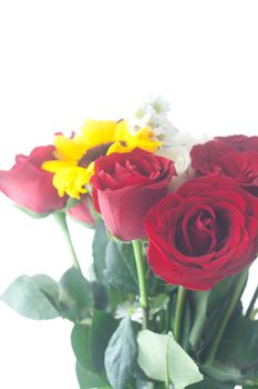 bouquet of red roses and sunflower in a vase 