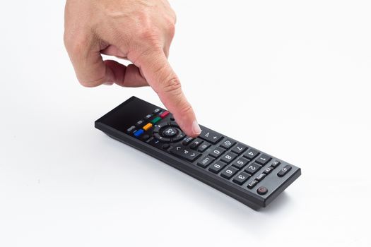 man hand push remote control on white