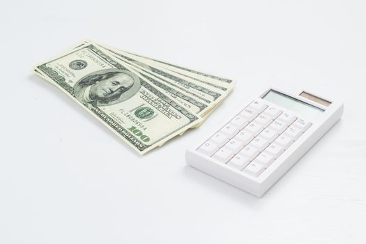 US bank note and calculator on white background