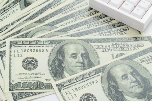 US bank note and calculator on white background