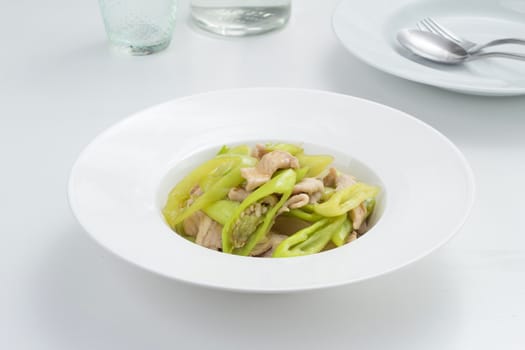 pork fried with sweet pepper. Thai food on white dish