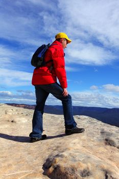A mountain hike, touristr or bushwalker admiring views top of mountain.