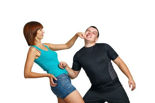 Woman punching her boyfriend in the face isolated on white background