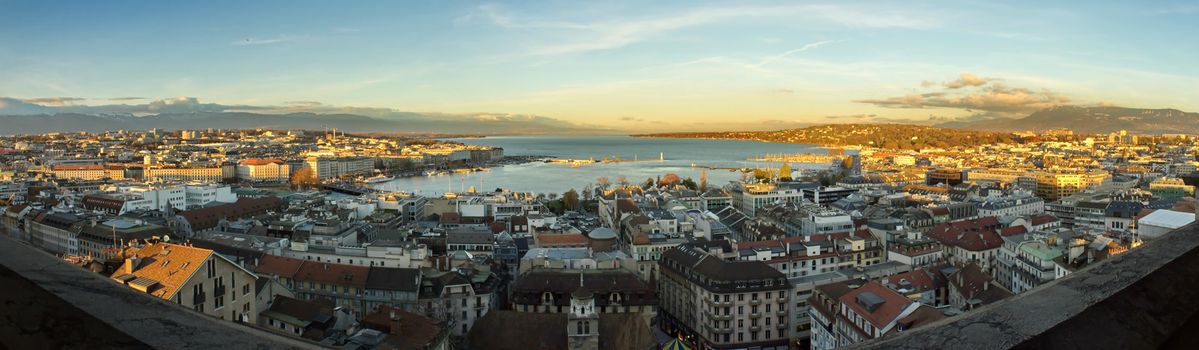 Panoramic view on Geneva city and lake by sunset from Saint-Pierre cathedral, Switzerland
