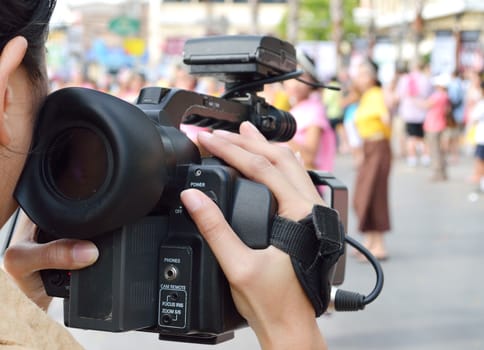 Cameraman recording video in the festival