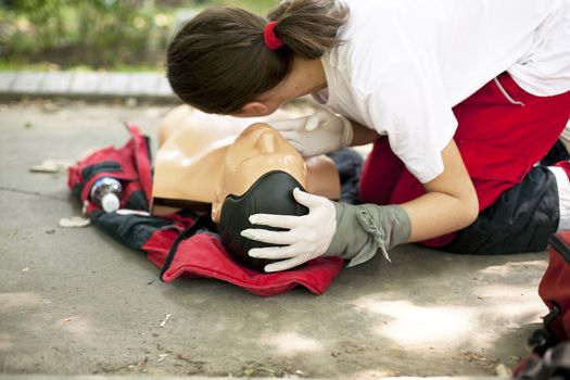 Demonstrating CPR on a dummy