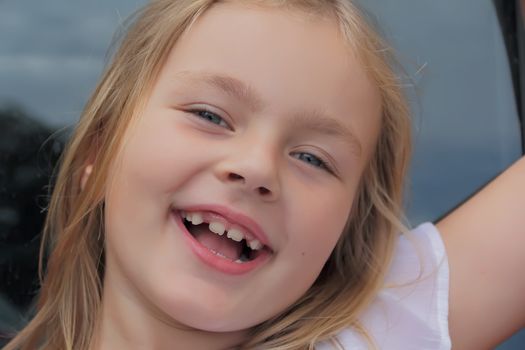 Portrait of girl with smile and open mouth