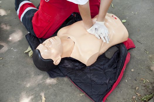 Demonstrating CPR on a dummy