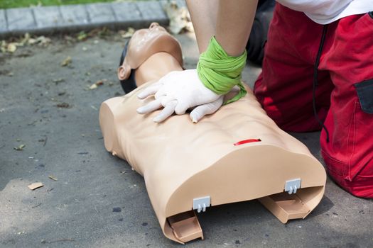 Demonstrating CPR on a dummy