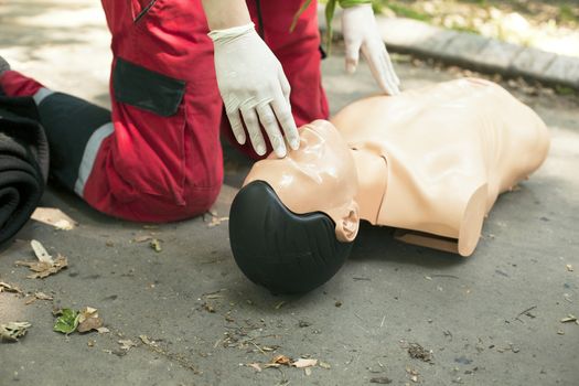 Demonstrating CPR on a dummy