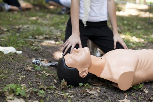 Demonstrating CPR on a dummy