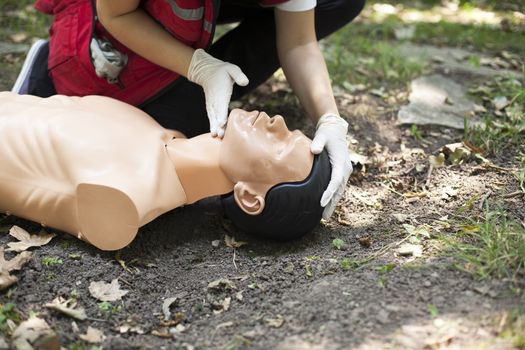 Demonstrating CPR on a dummy