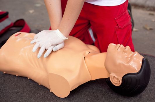 Demonstrating CPR on a dummy