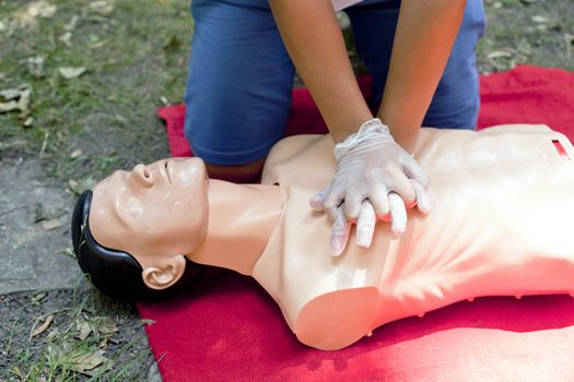 Demonstrating CPR on a dummy