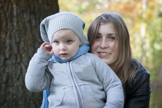 Mother and daughter on the walk in the park