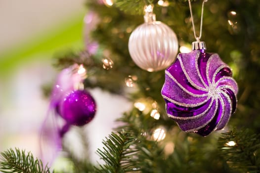 Christmas decorations and lights hanging on a Christmas tree