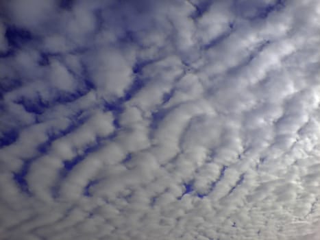 Blue sky and white clouds and the sun