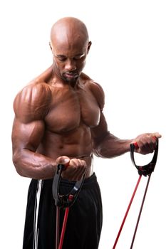 Ripped body builder working out his biceps using a resistance band. 