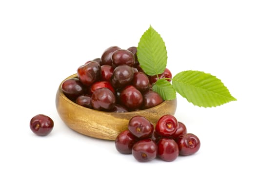 fresh cherries in a bowl on white background