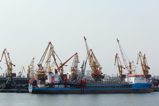 Boat at the dock with a cranes