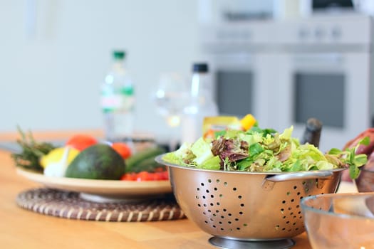 Salad leaves are on a kitchen