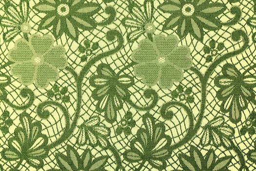 The green flowers on a textile background