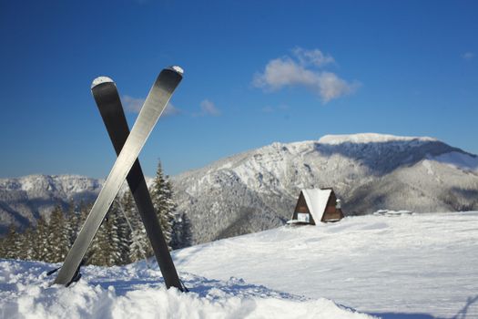 Skiing, winter season, mountains and ski equipments on ski run