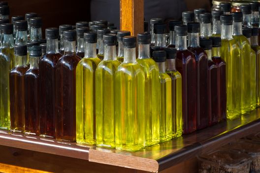 Bottles of raki on a stand along a Crete's road