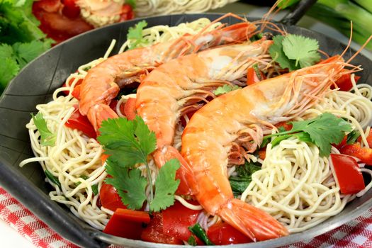 Black tiger prawns on Mie noodles with vegetables