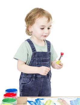 cute girl painting in white background. studio shot