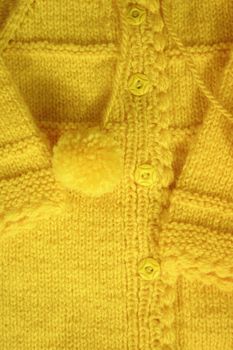 Close-up of a yellow color woolen pattern