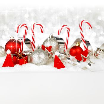 Christmas decorative shiny balls and ribbons on snow