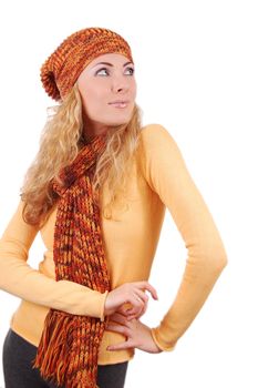 Woman in orange knitted hat, scar and sweater looking up isolated over white