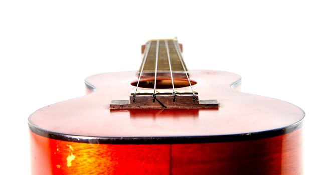 Old ukulele  on white background