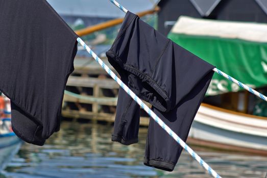 Laundry line on a boat with clothes in a marina
