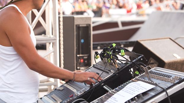 Sound control engineer in outdoor concert event