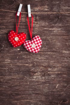 Two hearts .attached to the rope. Valentine greetings