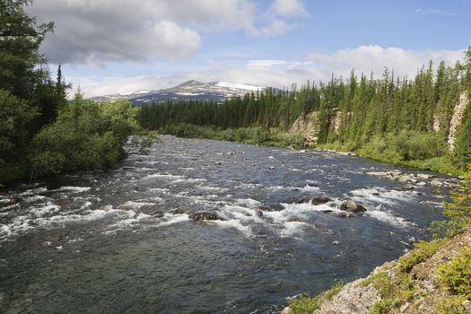 Rapid stream among rocks, Ural, northern Russia