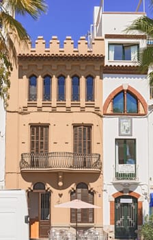 Sitges, Spain - September 21, 2013: Facade view at old  houses in Sitges, Spain. The town is major tourist place during the summer.