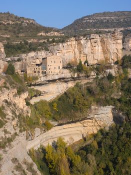 The monastic complex of Sant Miquel del Fai in Central Catalonia, Spain, which stays hanging in the middle of a cliff emulating the bird’s nests that also inhabit those water modeled rocks.