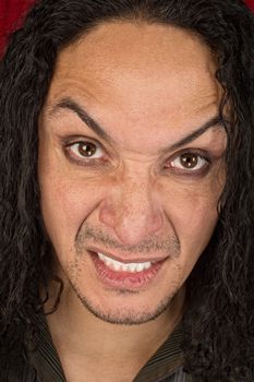 Close up of angry single man with long hair