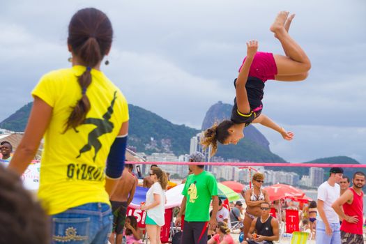 RIO DE JANEIRO - NOVEMBER 03 2012: Slackline contestant on the sands of Copacabana in Rio Elephant Cup tournament, held on November  03, 2012 on Copacabana, Rio de Janeiro, Brazil.