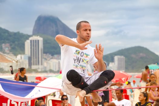 RIO DE JANEIRO - NOVEMBER 03 2012: Slackline contestant on the sands of Copacabana in Rio Elephant Cup tournament, held on November  03, 2012 on Copacabana, Rio de Janeiro, Brazil.