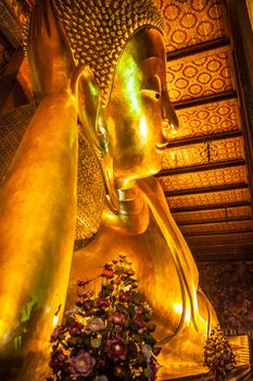 Reclining golden buddha in wat Pho temple, Bangkok, Thailand.