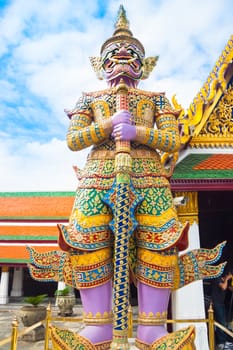 Giant statue in Wat Phra Kaew, Temple of the Emerald Buddha, full official name Wat Phra Si Rattana Satsadaram, is regarded as the most sacred Buddhist temple (wat) in Bangkok, Thailand.