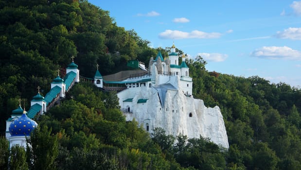 Church on a hill among trees