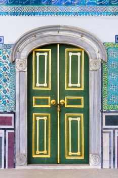 Ancient wooden door in  The Topkapi Palace, a large palace in Istanbul, Turkey, that was the primary residence of the Ottoman Sultans.