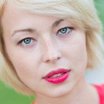 Portrait of a self-confident woman shot outside in the garden.