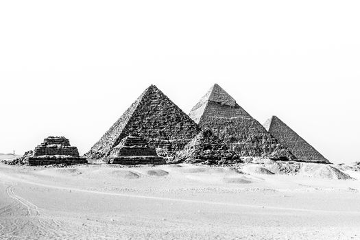 The pyramids of Giza, Cairo, Egypt;  the oldest of the Seven Wonders of the Ancient World, and the only one to remain largely intact. Black and white.