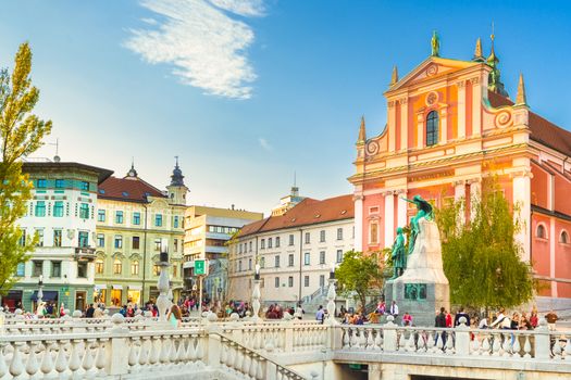 Romantic Ljubljana's city center:  river Ljubljanica, Triple Bridge (Tromostovje), Preseren square and Franciscan Church of the Annunciation; Ljubljana, Slovenia, Europe.